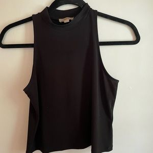 High neck black tank. Since small, smart set.